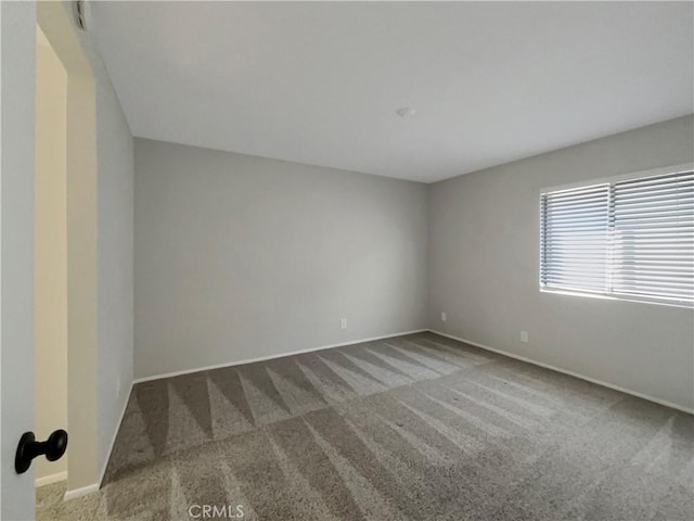 28021 Sarabande Ln Unit 1209, Canyon Country, CA 91387 - empty room with carpet flooring and baseboards