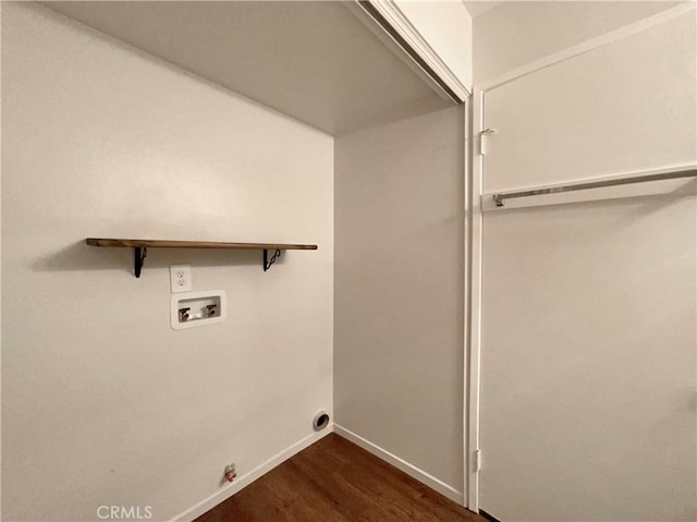 28021 Sarabande Ln Unit 1209, Canyon Country, CA 91387 - washroom with washer hookup and dark wood-type flooring