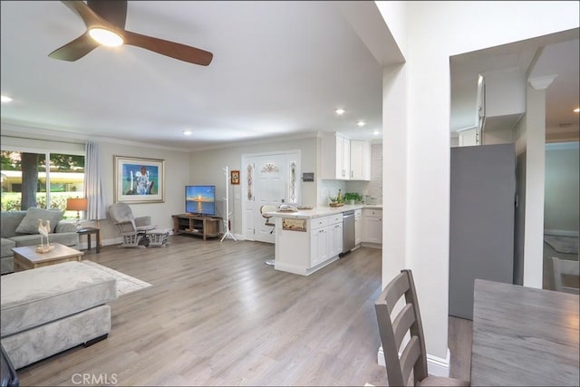 2358 Via Mariposa E Unit B, Laguna Woods, CA 92637 - living room with a ceiling fan, ornamental molding, recessed lighting, and light wood finished floors