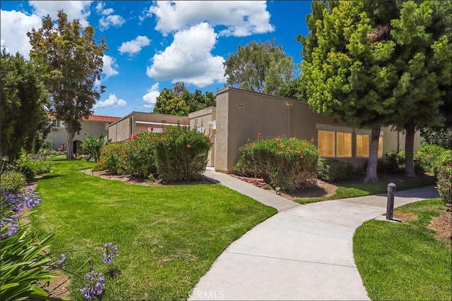 2358 Via Mariposa E Unit B, Laguna Woods, CA 92637 - view of community featuring a yard