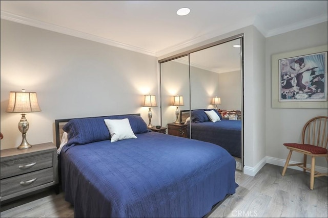 2358 Via Mariposa E Unit B, Laguna Woods, CA 92637 - bedroom featuring light wood-style flooring, ornamental molding, and a closet