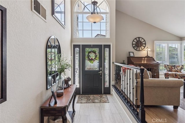 27201 Via Aurora, Mission Viejo, CA 92691 - entryway with a textured wall and high vaulted ceiling