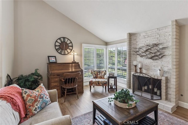 27201 Via Aurora, Mission Viejo, CA 92691 - living room with lofted ceiling, wood finished floors, and a fireplace