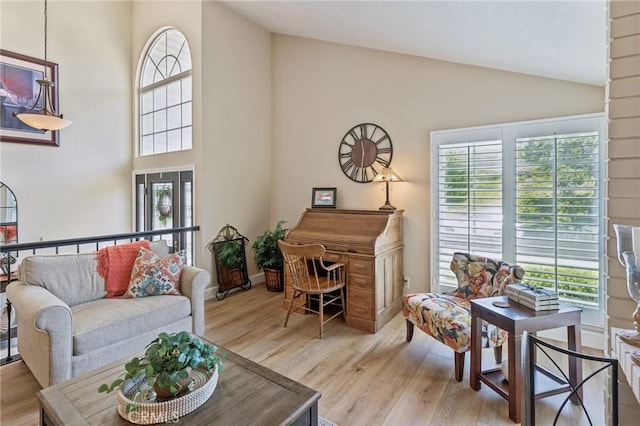 27201 Via Aurora, Mission Viejo, CA 92691 - living room with high vaulted ceiling and light wood-style flooring