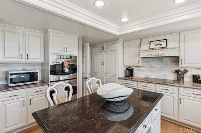 27201 Via Aurora, Mission Viejo, CA 92691 - kitchen featuring stainless steel appliances, white cabinetry, decorative backsplash, crown molding, and recessed lighting
