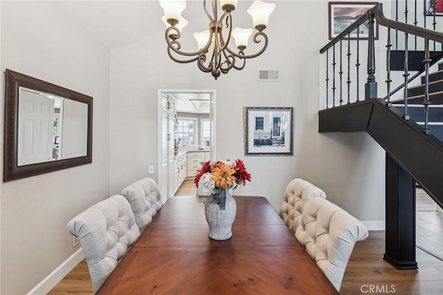 27201 Via Aurora, Mission Viejo, CA 92691 - dining room featuring a chandelier, stairs, and wood finished floors