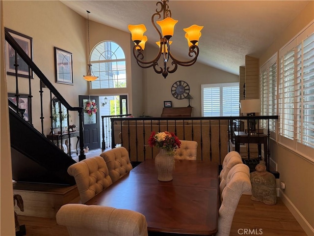 27201 Via Aurora, Mission Viejo, CA 92691 - dining area with lofted ceiling, wood finished floors, plenty of natural light, a chandelier, and a textured ceiling