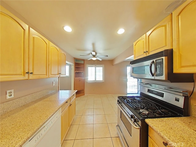 16069 Vine St, Hesperia, CA 92345 - kitchen with stainless steel appliances, light brown cabinets, ceiling fan, recessed lighting, and light stone countertops