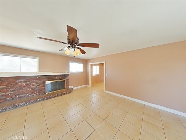 16069 Vine St, Hesperia, CA 92345 - unfurnished living room with ceiling fan, a brick fireplace, and light tile patterned floors