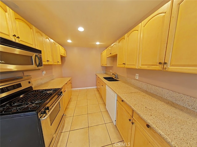 16069 Vine St, Hesperia, CA 92345 - kitchen featuring stainless steel appliances, recessed lighting, light tile patterned floors, light stone countertops, and light brown cabinetry