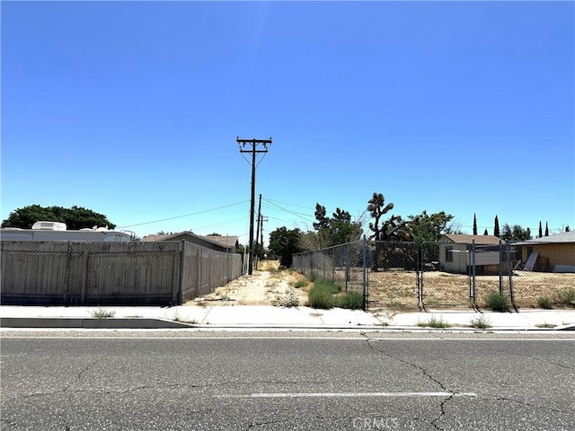 16069 Vine St, Hesperia, CA 92345 - view of asphalt street with sidewalks and curbs