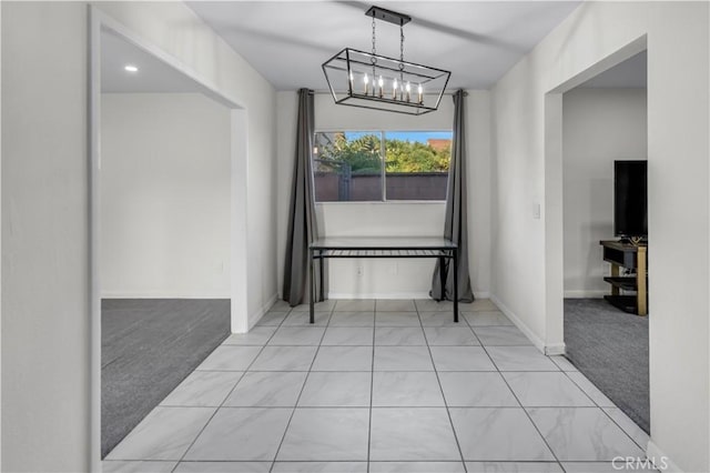 17790 Merrill Ave, Fontana, CA 92335 - unfurnished dining area with light colored carpet and a chandelier