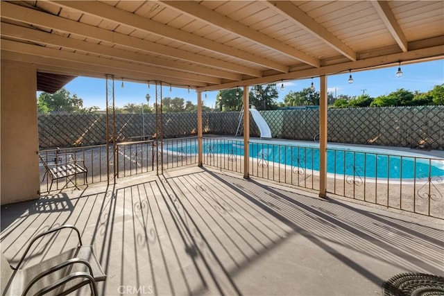 17790 Merrill Ave, Fontana, CA 92335 - view of swimming pool featuring a water slide and a fenced backyard
