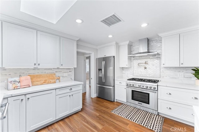 1915 Mariners Dr, Newport Beach, CA 92660 - kitchen with stainless steel appliances, wall chimney range hood, backsplash, white cabinets, and light countertops