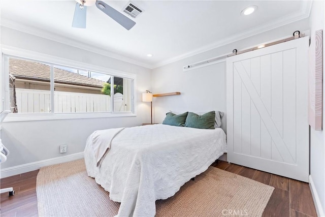 1915 Mariners Dr, Newport Beach, CA 92660 - bedroom featuring ornamental molding, wood finished floors, a ceiling fan, a barn door, and recessed lighting