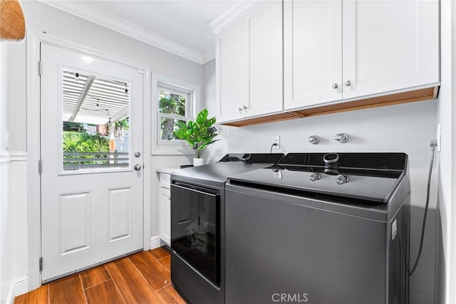 1915 Mariners Dr, Newport Beach, CA 92660 - laundry room featuring washer and clothes dryer, dark wood-type flooring, ornamental molding, and cabinet space