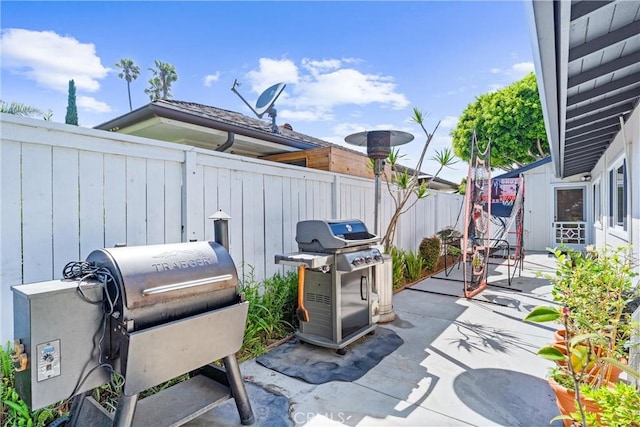 1915 Mariners Dr, Newport Beach, CA 92660 - fenced backyard featuring a patio area and grilling area