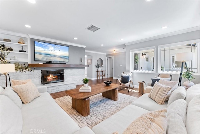 1915 Mariners Dr, Newport Beach, CA 92660 - living room with ornamental molding, recessed lighting, wood finished floors, and a stone fireplace