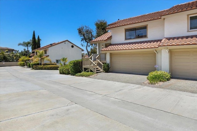 6684 Corte Maria, Carlsbad, CA 92009 - mediterranean / spanish home with a tiled roof, stucco siding, driveway, and a garage