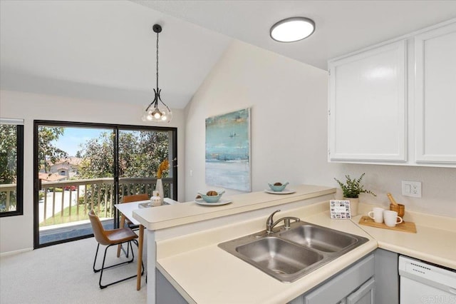 6684 Corte Maria, Carlsbad, CA 92009 - kitchen featuring white dishwasher, a peninsula, light colored carpet, light countertops, and vaulted ceiling