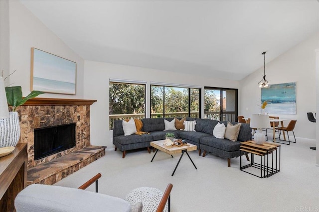 6684 Corte Maria, Carlsbad, CA 92009 - living room featuring vaulted ceiling, carpet, and a stone fireplace