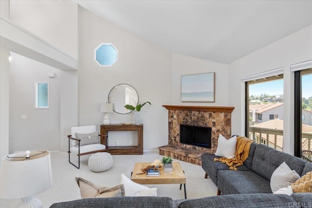 6684 Corte Maria, Carlsbad, CA 92009 - living room with carpet floors, high vaulted ceiling, and a stone fireplace