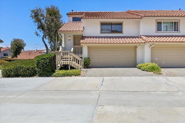 6684 Corte Maria, Carlsbad, CA 92009 - mediterranean / spanish house featuring stucco siding, a tile roof, concrete driveway, and a garage