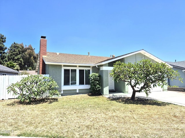 386 Otono Ct, Camarillo, CA 93012 - view of front of property featuring driveway, stucco siding, a garage, and a chimney