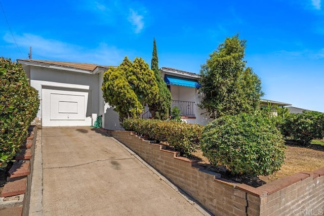 855 Quail St, San Diego, CA 92102 - view of property hidden behind natural elements featuring stucco siding