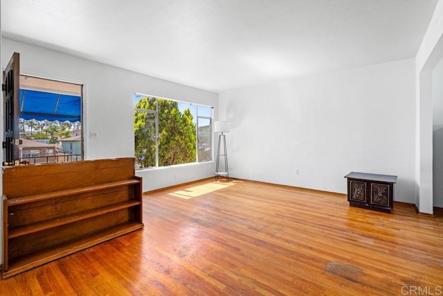 855 Quail St, San Diego, CA 92102 - unfurnished living room featuring wood finished floors and baseboards
