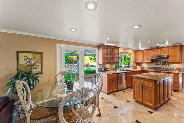 24236 Via, San Clemente, Mission Viejo, CA 92692 - kitchen featuring stainless steel dishwasher, under cabinet range hood, plenty of natural light, brown cabinets, and recessed lighting