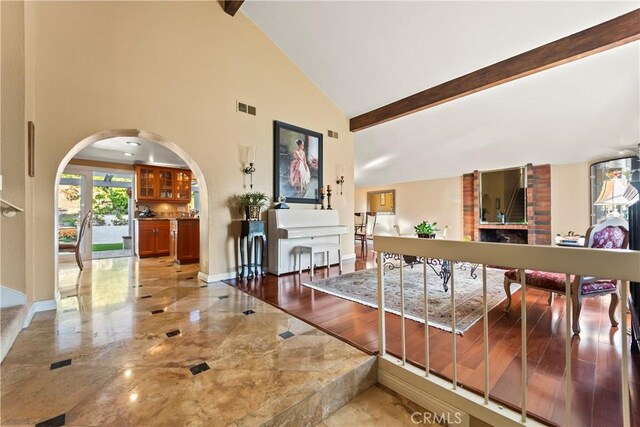 24236 Via, San Clemente, Mission Viejo, CA 92692 - hall featuring arched walkways, high vaulted ceiling, beamed ceiling, and marble tiled floors