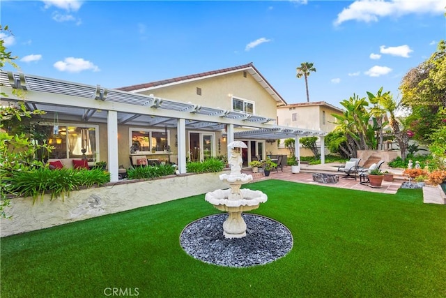 24236 Via, San Clemente, Mission Viejo, CA 92692 - back of house featuring a patio area, a pergola, a lawn, stucco siding, and a fire pit