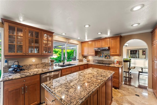 24236 Via, San Clemente, Mission Viejo, CA 92692 - kitchen with stainless steel dishwasher, under cabinet range hood, black electric cooktop, crown molding, and brown cabinets