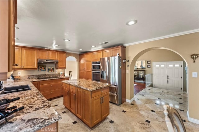 24236 Via, San Clemente, Mission Viejo, CA 92692 - kitchen featuring arched walkways, stainless steel appliances, ornamental molding, under cabinet range hood, and recessed lighting