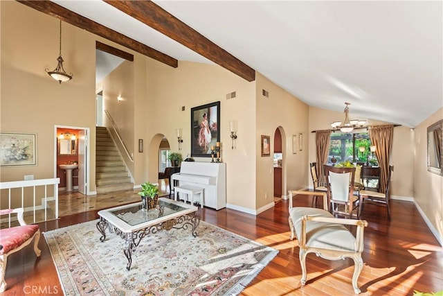 24236 Via, San Clemente, Mission Viejo, CA 92692 - living area featuring arched walkways, stairway, wood finished floors, high vaulted ceiling, and a chandelier