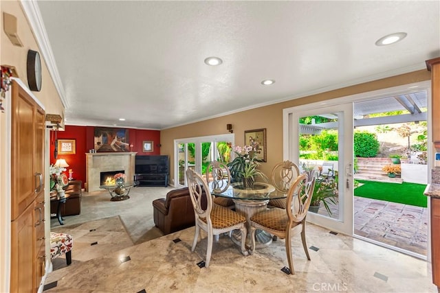 24236 Via, San Clemente, Mission Viejo, CA 92692 - dining area featuring crown molding, a lit fireplace, and recessed lighting