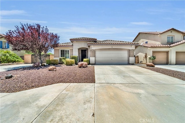 43627 Rialto Dr, Lancaster, CA 93535 - mediterranean / spanish home with driveway, a garage, stucco siding, and a tiled roof
