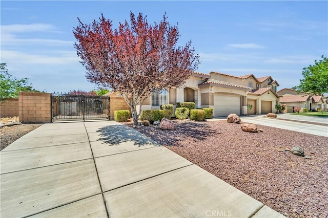 43627 Rialto Dr, Lancaster, CA 93535 - view of front of home with concrete driveway, stucco siding, a gate, a garage, and a tiled roof
