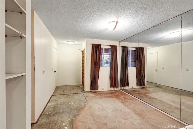 2600 Torrey Pines Rd Unit A13, La Jolla, CA 92037 - hallway with a textured ceiling