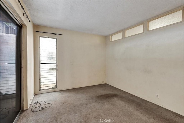 2600 Torrey Pines Rd Unit A13, La Jolla, CA 92037 - carpeted spare room with a textured ceiling