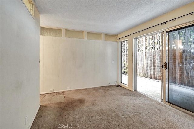 2600 Torrey Pines Rd Unit A13, La Jolla, CA 92037 - spare room with a textured ceiling and carpet