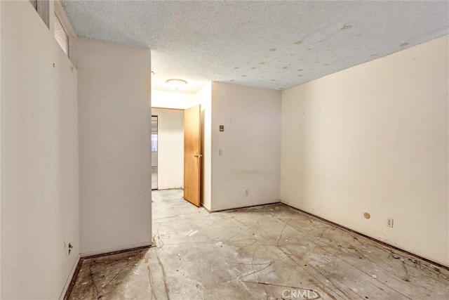 2600 Torrey Pines Rd Unit A13, La Jolla, CA 92037 - spare room with a textured ceiling