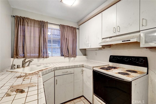 2600 Torrey Pines Rd Unit A13, La Jolla, CA 92037 - kitchen featuring white appliances, white cabinets, tile countertops, and under cabinet range hood