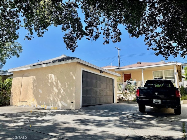 3257 Honolulu Ave, Glendale, CA 91214 - view of property exterior with stucco siding, a garage, and an outdoor structure