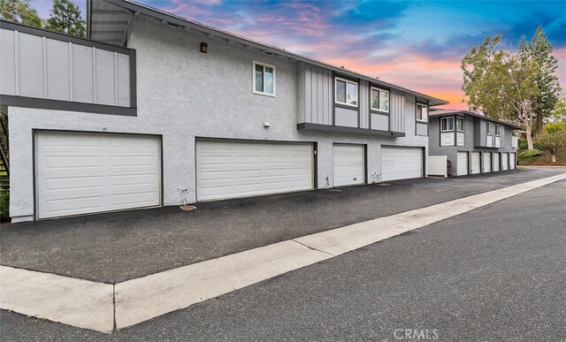 6567 Woodburn Ln Unit 7, Yorba Linda, CA 92886 - view of front of home with a garage and stucco siding