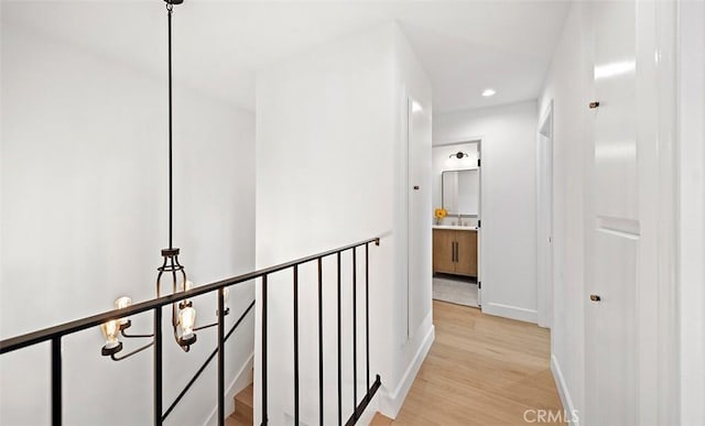 6567 Woodburn Ln Unit 7, Yorba Linda, CA 92886 - corridor with light wood-style flooring, recessed lighting, and an upstairs landing