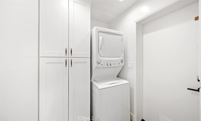 6567 Woodburn Ln Unit 7, Yorba Linda, CA 92886 - washroom featuring stacked washing machine and dryer and cabinet space