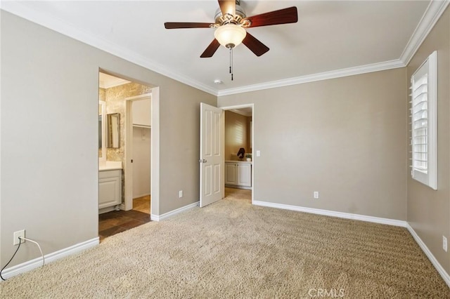 78 Windchime, Irvine, CA 92603 - unfurnished bedroom with crown molding, carpet flooring, connected bathroom, a ceiling fan, and a spacious closet