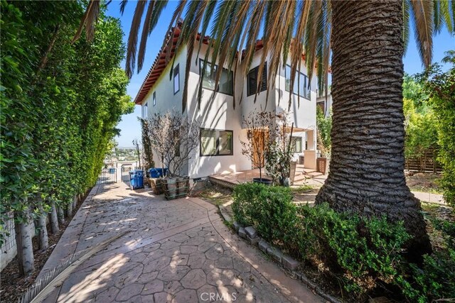 1409 Laveta, Los Angeles, CA 90026 - view of side of home with stucco siding and a patio area